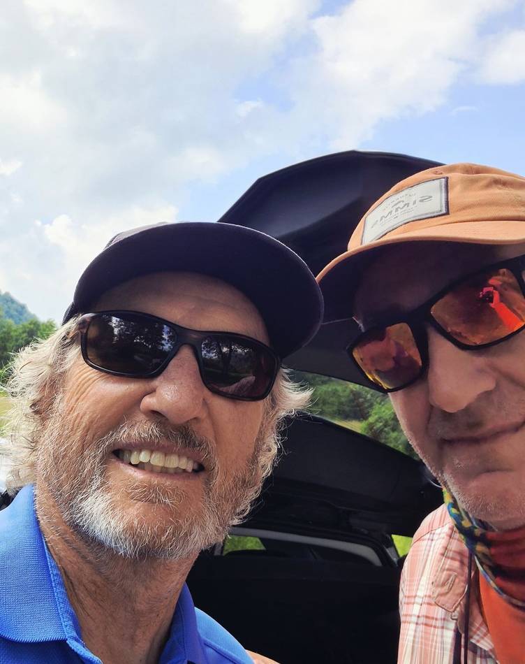 Two anglers sharing a selfie by the car