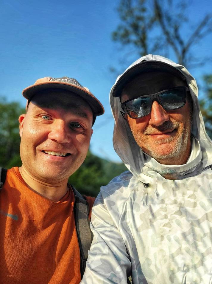 Two anglers smiling in the sun