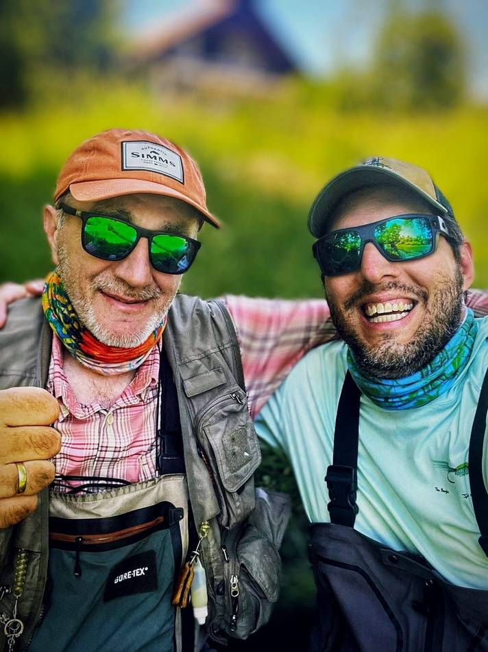 Two anglers smiling in a close-up selfie