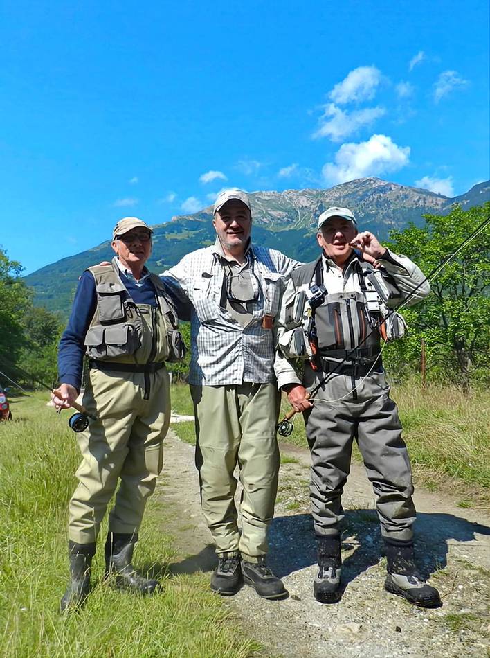 Three anglers on a mountain track