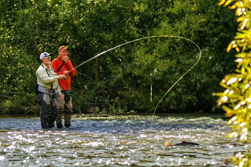 Two anglers casting on the river