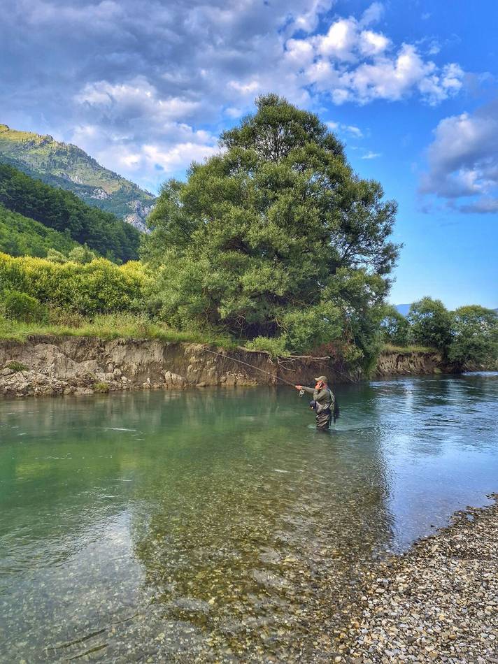 Mid-cast beneath the mountains