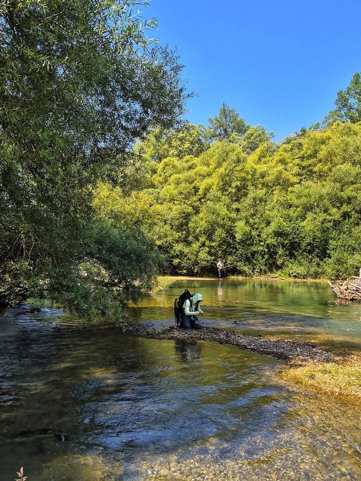 Sharing a catch on the gravel bar