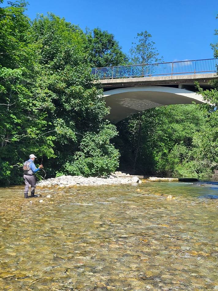 Fly fishing beneath the bridge on the Tara