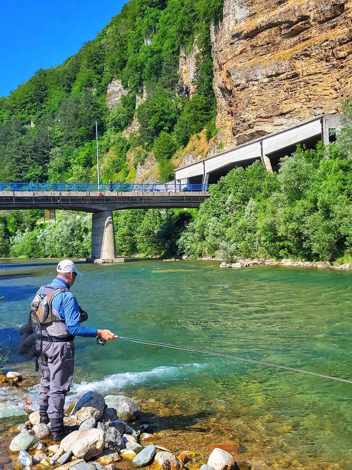 Fishing beneath the bridge, Tara river